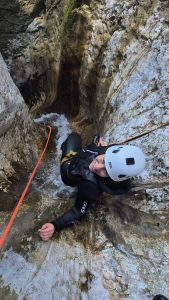 Canyoner rappelling in Jerečica canyon near Bohinj, Slovenia