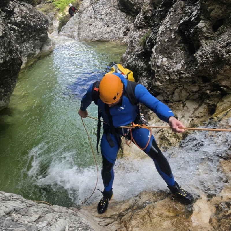 Canyoner rappeling in a Fratarica Canyon