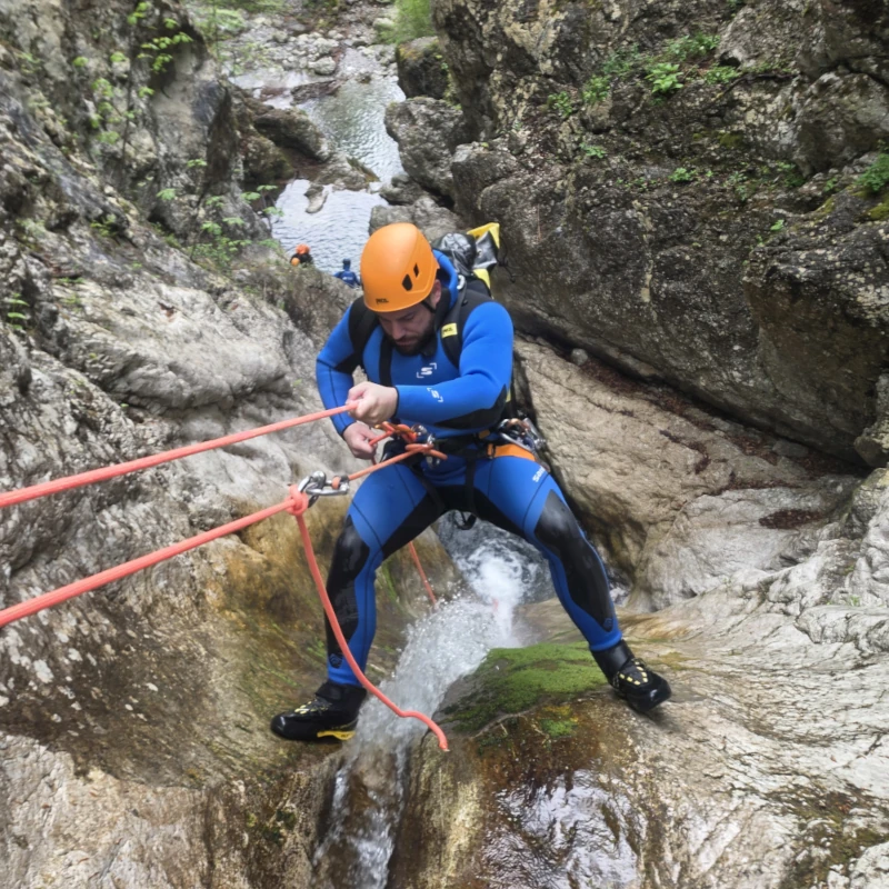 Canyoner rappeling in a Susec Canyon